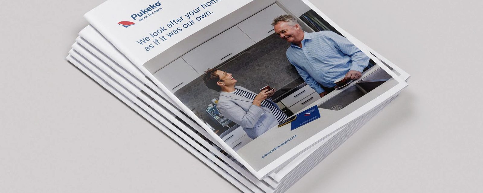 A stack of Pukeko Rental Managers brochures seen from above.