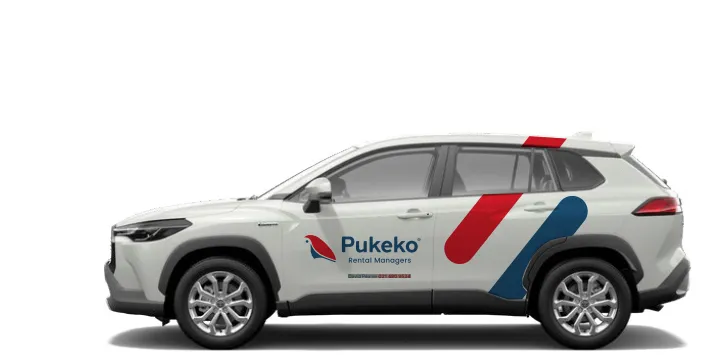 A white Pukeko Rental Managers car with red and blue livery.